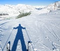A shadow of ready to go downhill skier