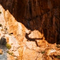 Shadow of a rock climber, climbing on the mountain Royalty Free Stock Photo