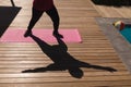 Shadow of a senior woman performing stretching exercise Royalty Free Stock Photo