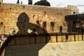 Shadow silhouette of a Israeli soldier Israel Defense Forces, IDF salutes on a Western Wall Kotel in Old City of Jerusalem