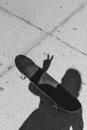 Shadow of a skateboarder on the concrete street