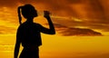 Shadow, sunset and silhouette woman drinking water for marathon running, fitness exercise and hiking workout on outdoor Royalty Free Stock Photo