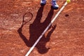 Shadow of a Tennis Player on a Clay Tennis Court