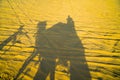 Shadow camel ride in desert