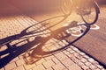 Shadow of unrecognizable cyclist on bicycle lane Royalty Free Stock Photo