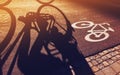 Shadow of unrecognizable cyclist on bicycle lane Royalty Free Stock Photo