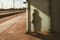 Shadow of unrecognizable human on the glass wall of the train station Royalty Free Stock Photo