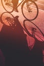 Shadow of unrecognizable person riding bicycle Royalty Free Stock Photo