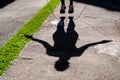 shadow of woman with black clothing jumping rope in the park Royalty Free Stock Photo