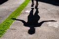 shadow of woman with black clothing jumping rope in the park Royalty Free Stock Photo