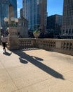 Shadow of woman and light fixture in Chicago Loop