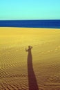 Shadow of woman on the sands dunes Corralejo Fuerteventura