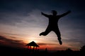 Shadow of women Jumping at the top of the mountain During sunset Royalty Free Stock Photo