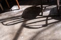 Shadow of wooden chair on grunge cement floor Royalty Free Stock Photo