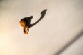 Shadow of the wooden hanger hook White wallpaper wall.soft focus Royalty Free Stock Photo