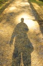 Shadow of Young Man standing alone in forest Royalty Free Stock Photo