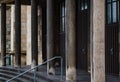 Shadowed and aged stone pillars of gothic church