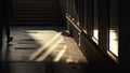 Shadowplay and reflections : passerbys walking through a passage gangway