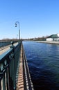 Shadows along the Owasco Lake canal pier walkway Royalty Free Stock Photo
