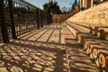 Shadows cast patterns from the fence surrounding the Garden of Gethsemane in Jerusalem