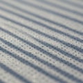 Shadows create linear patterns across a surface dotted with small water droplets. Royalty Free Stock Photo