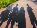 Shadows of family visiting a landmark in Delhi