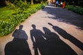 Shadows of family visiting a landmark in Delhi, India