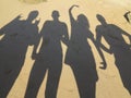 Shadows of five young peole having fun on the beach on Cyprus