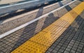 Shadows on the floor at a bus stop Royalty Free Stock Photo