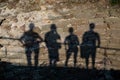 Shadows from four people on the wall Royalty Free Stock Photo