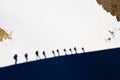 Shadows of group of mountain trekkers on a snow Royalty Free Stock Photo