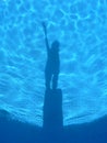 Shadows in the light blue swiming pool. Royalty Free Stock Photo
