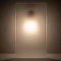 Shadows and light play across a textured, frosted glass panel, creating an effect of obscured Royalty Free Stock Photo