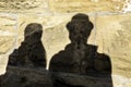 Shadows of a pair of lovers on the big rocks of a medieval castle