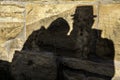 Shadows of a pair of lovers on the big rocks of a medieval castle