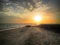 Shadows of people enjoying the sea at sunset Royalty Free Stock Photo