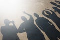 Shadows of people group on the street in sunny day