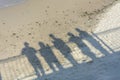 Shadows of people on sand near the sea. Concept of recollection, farewell to loved ones, departure to another reality, death