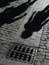 Shadows of people on street Royalty Free Stock Photo