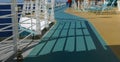 Shadows, railing & deck chairs Royalty Free Stock Photo