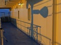 Shadows of the Ships Railing and crane made by the Setting sun in April Royalty Free Stock Photo