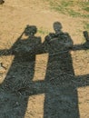 shadows of two men standing Royalty Free Stock Photo