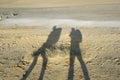 Shadows of two travellers Royalty Free Stock Photo