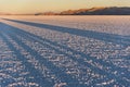 Shadows in the world`s largest salt flat, Salar de Uyuni in Bolivia, photographed at sunrise