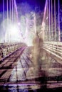 Shadowy figure walking on defocused bridge Royalty Free Stock Photo