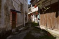 Shady alleyway between aged buildings in town