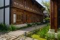 Shady alleyway between Chinese traditional buildings in sunny summer morning