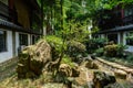 Shady flagstone path between Chinese traditional buildings in su Royalty Free Stock Photo