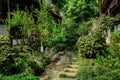 Shady flagstone path between old-fashioned Chinese dwellingl bui Royalty Free Stock Photo