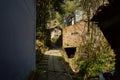 Shady hillside alley in ancient houses